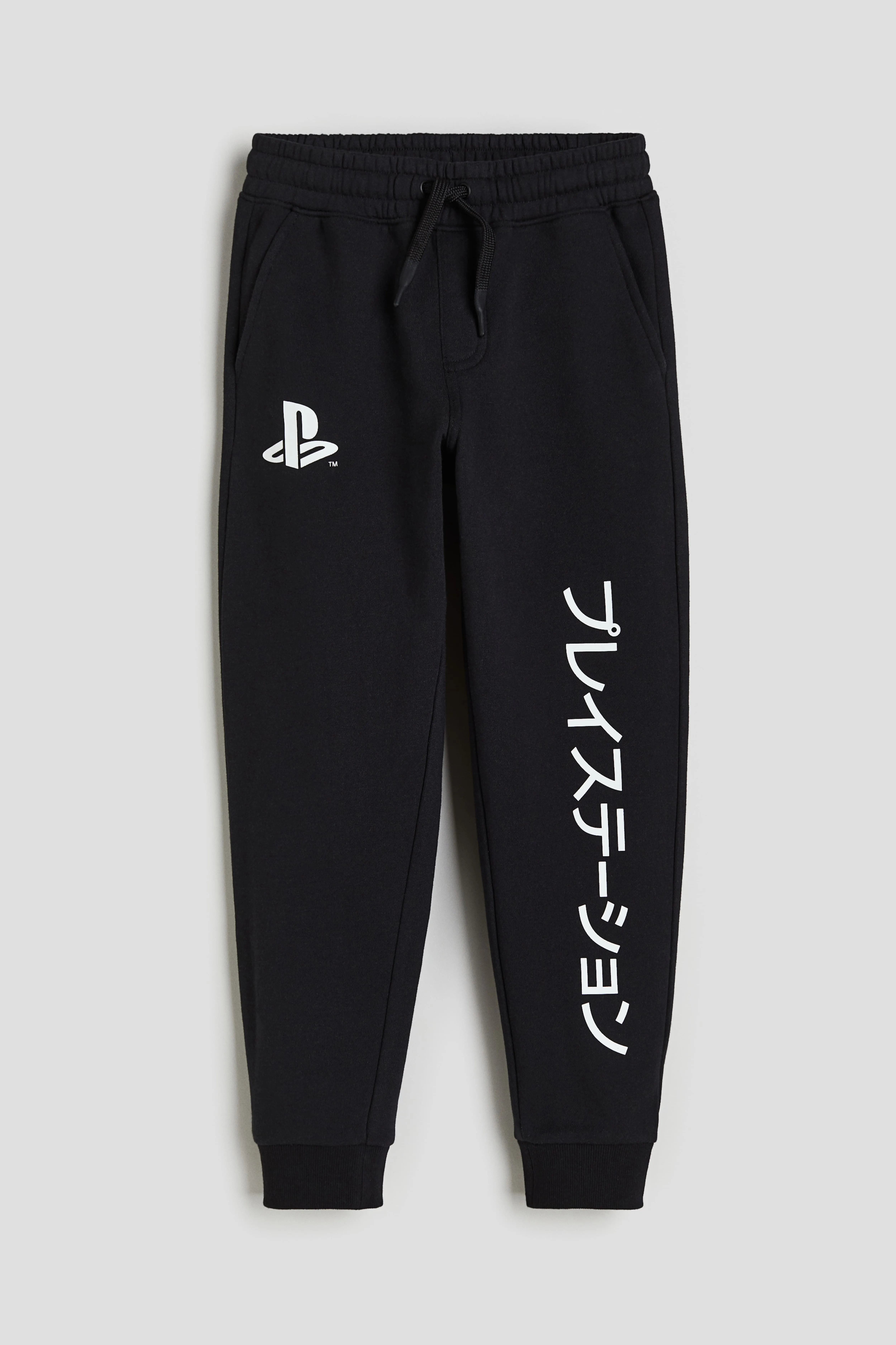 Printed joggers - Regular waist - Long - Black/PlayStation - Kids | H&M GB